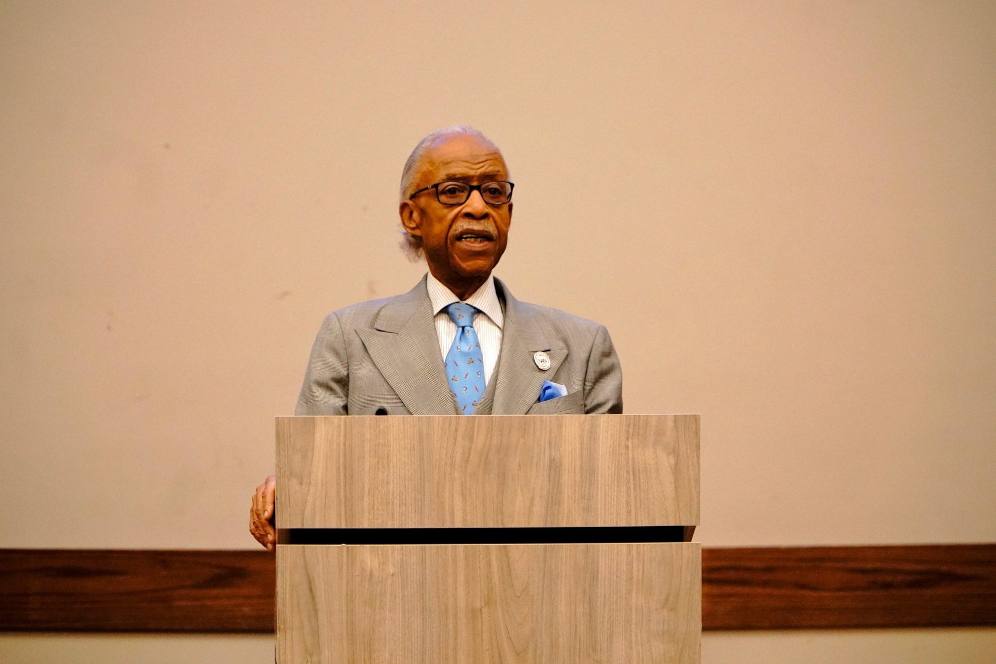 Rev. Al Sharpton speaks from the podium at the Northwest Activities Center in Detroit
