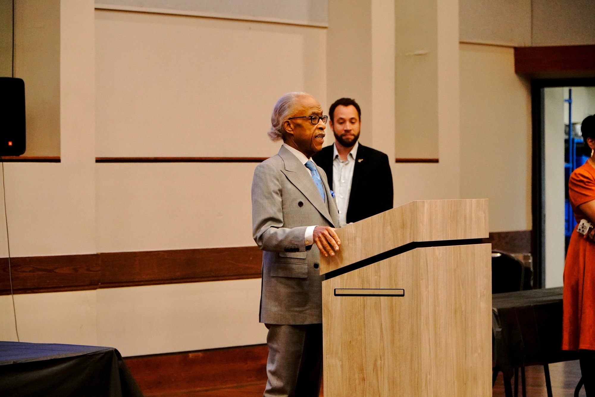 Rev. Al Sharpton speaks as a Save America Movement partner looks on