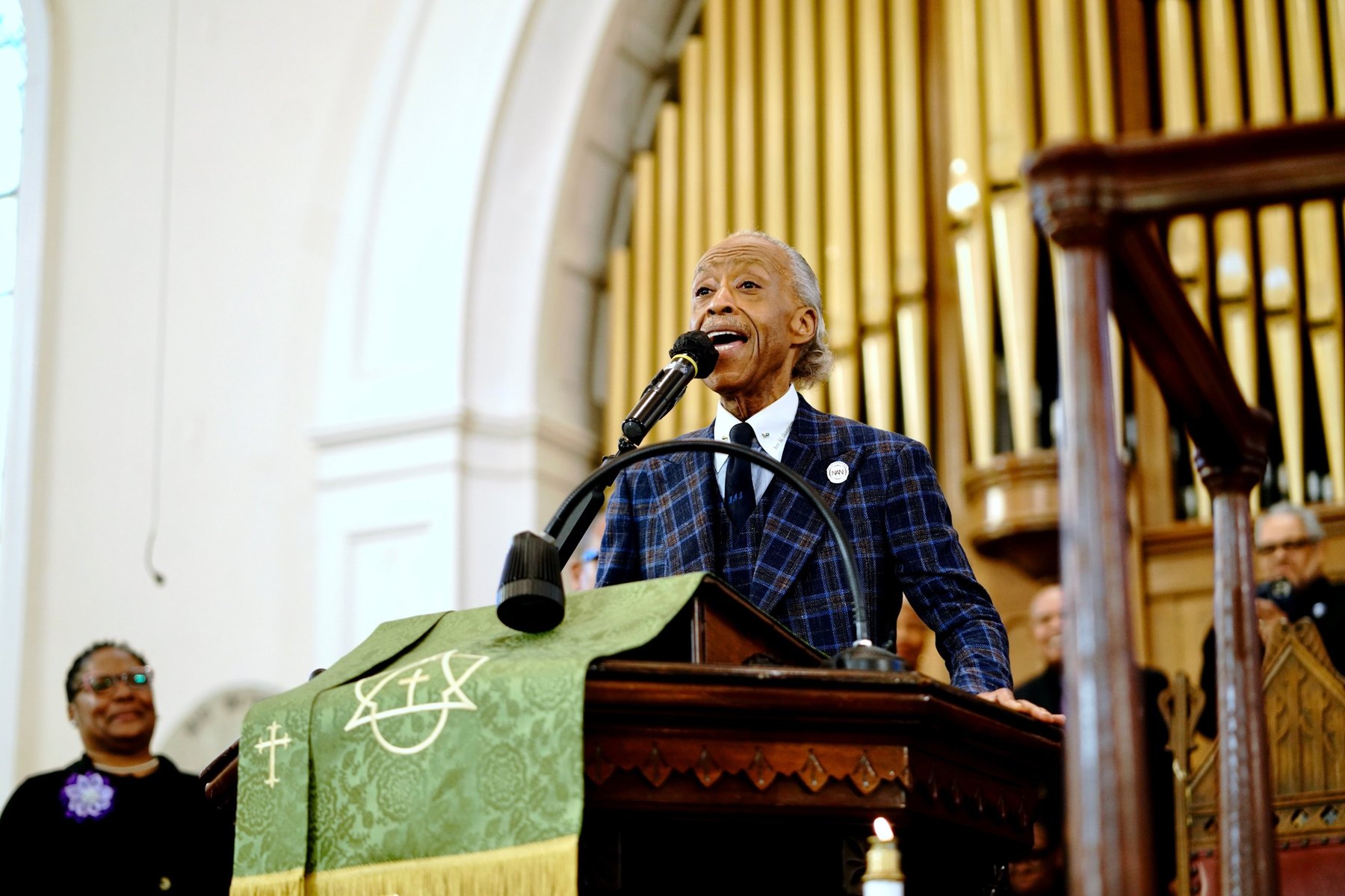 Rev. Al Sharpton preaches from the pulpit of Big Bethel A.M.E. Church beneath the organ pipes