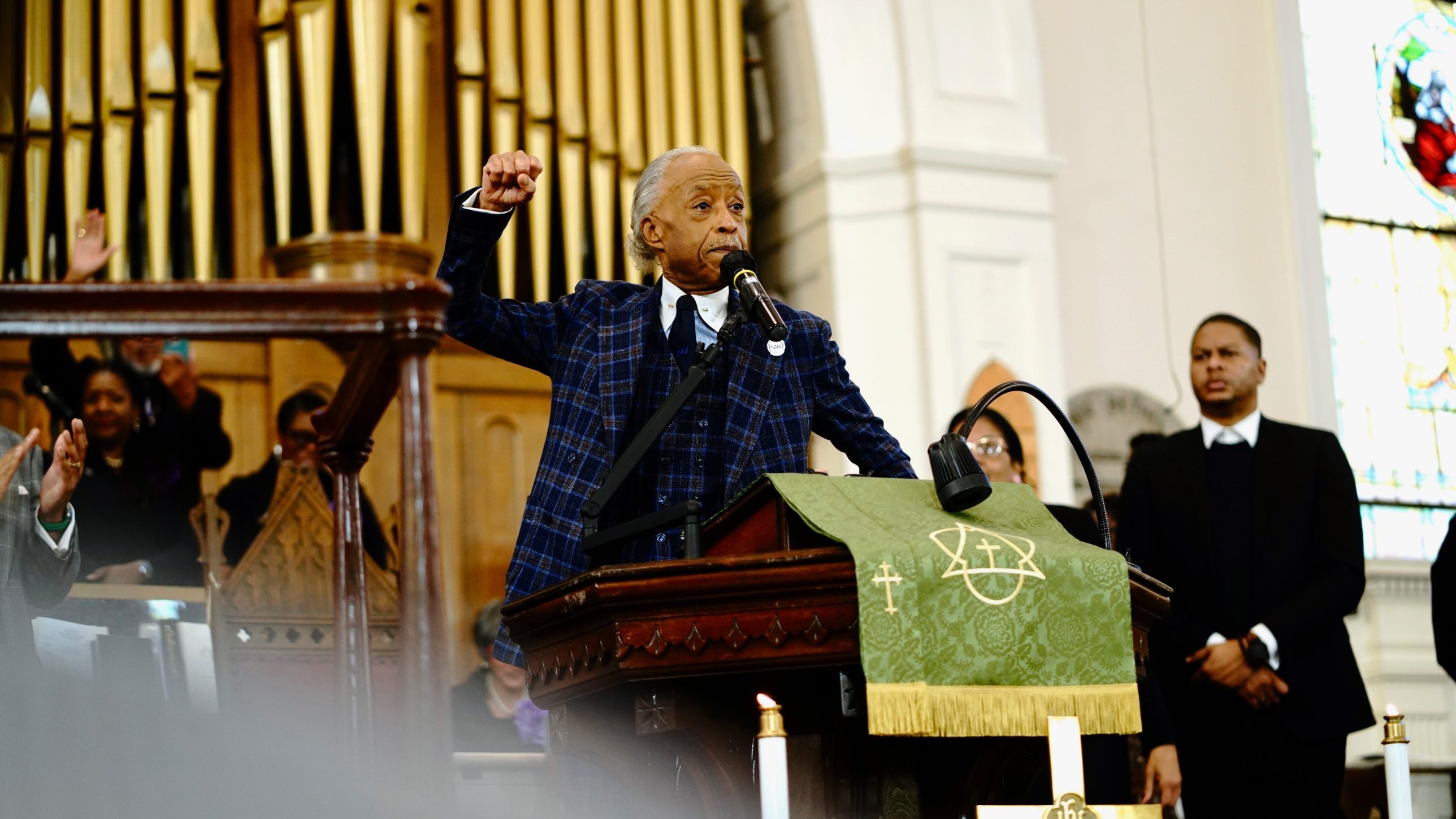 Rev. Al Sharpton raises his fist from the pulpit of Big Bethel A.M.E. Church in Atlanta, Sunday October 25, 2026