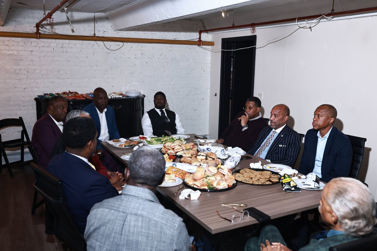 Ministers and community leaders listening during the meeting at the House of Justice