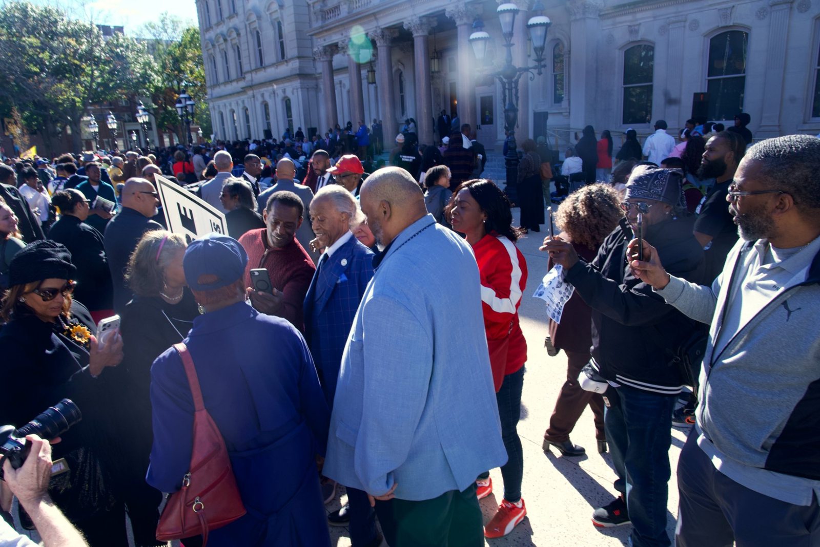 Rev. Al Sharpton greets community members in the crowd at the Black Agenda Rally
