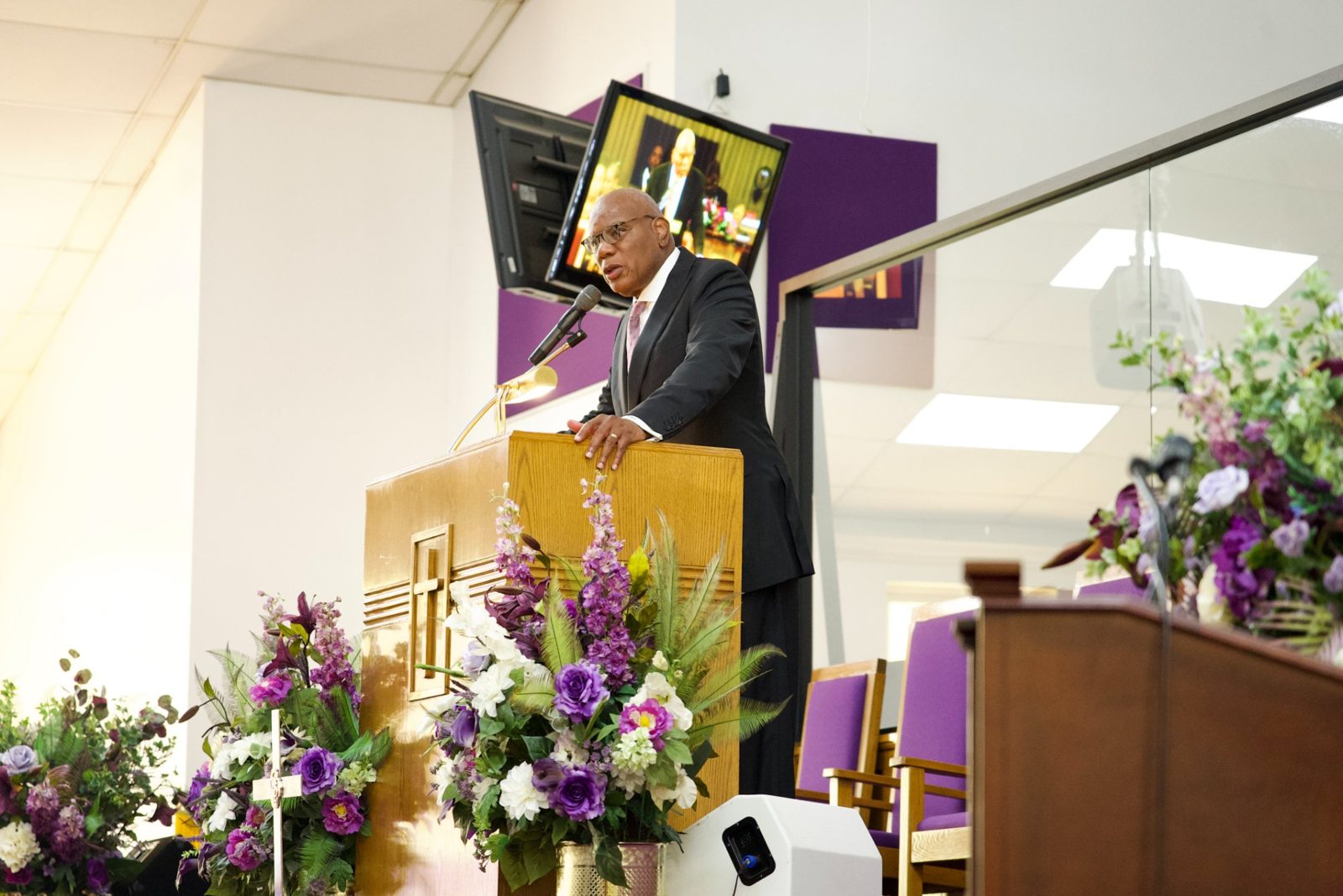 Pastor R.B. Holmes Jr. speaking from the pulpit during the anniversary celebration