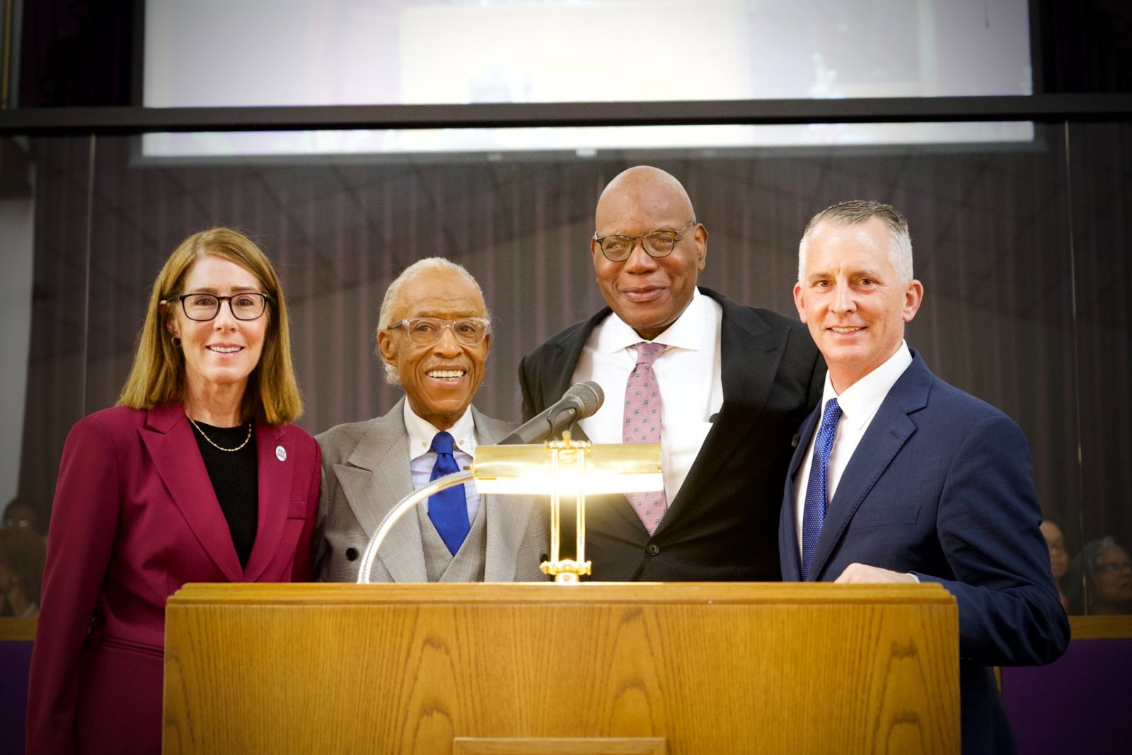 Rev. Al Sharpton, Pastor R.B. Holmes Jr., former Congressman David Jolly, and a fellow leader together at the pulpit