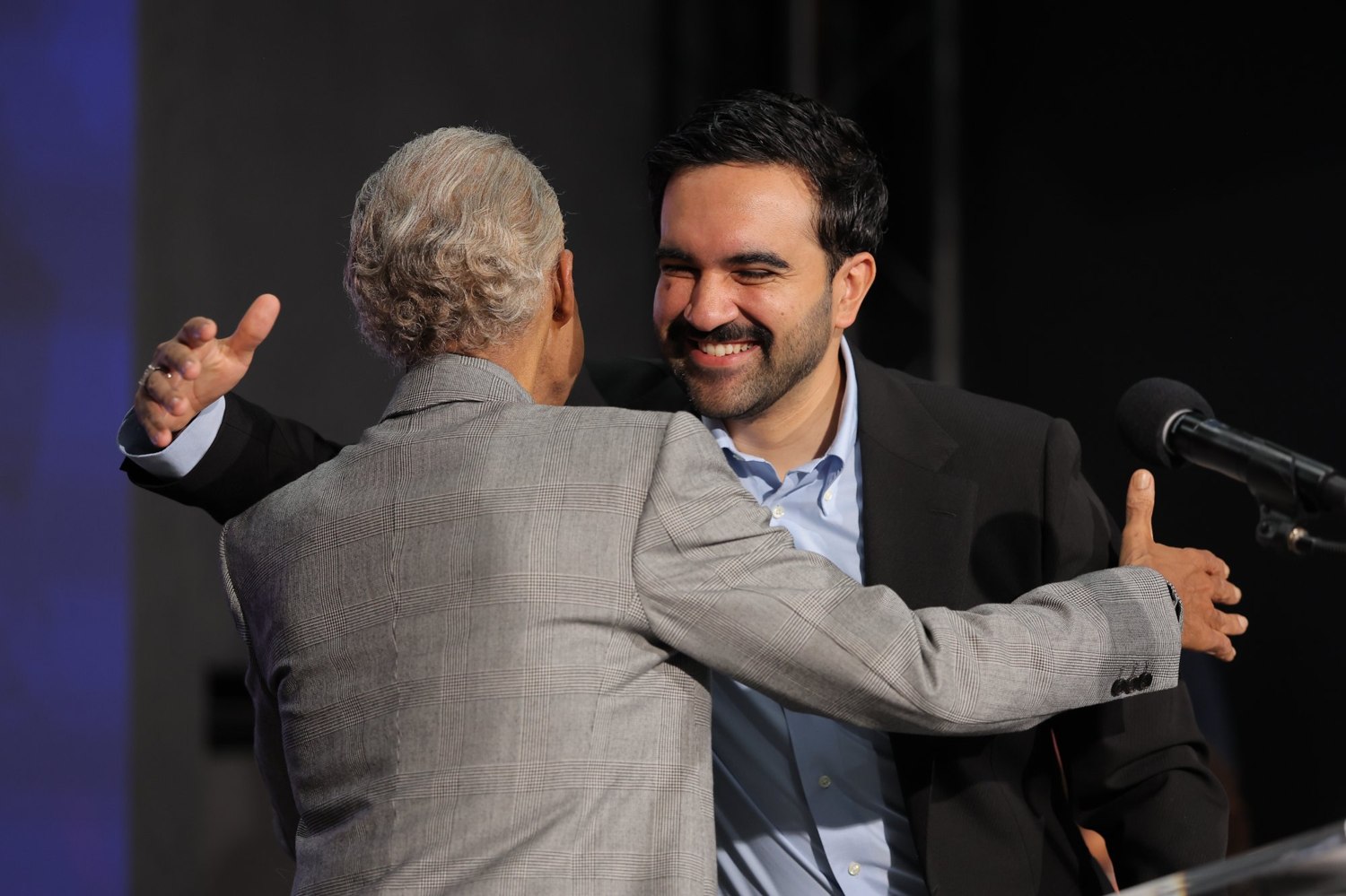 Rev. Al Sharpton welcomes New York City Mayor Zohran Mamdani to the House of Justice stage with an embrace