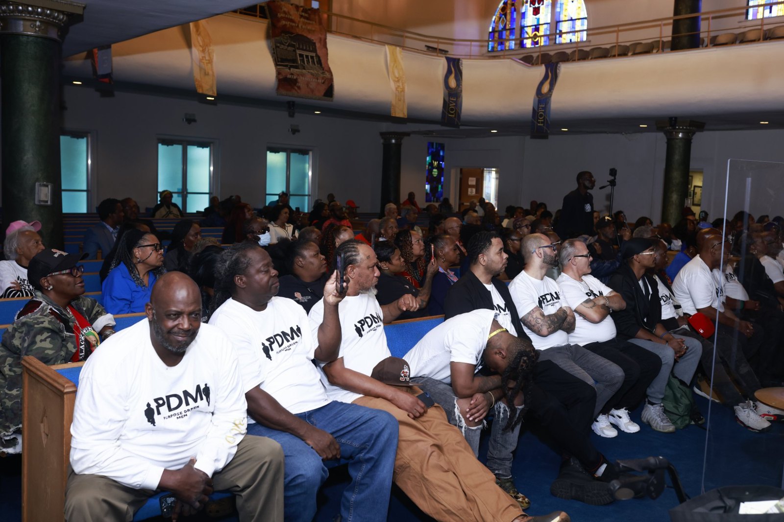 Members of Purpose Driven Men seated together in the pews at Greater Abyssinia Baptist Church