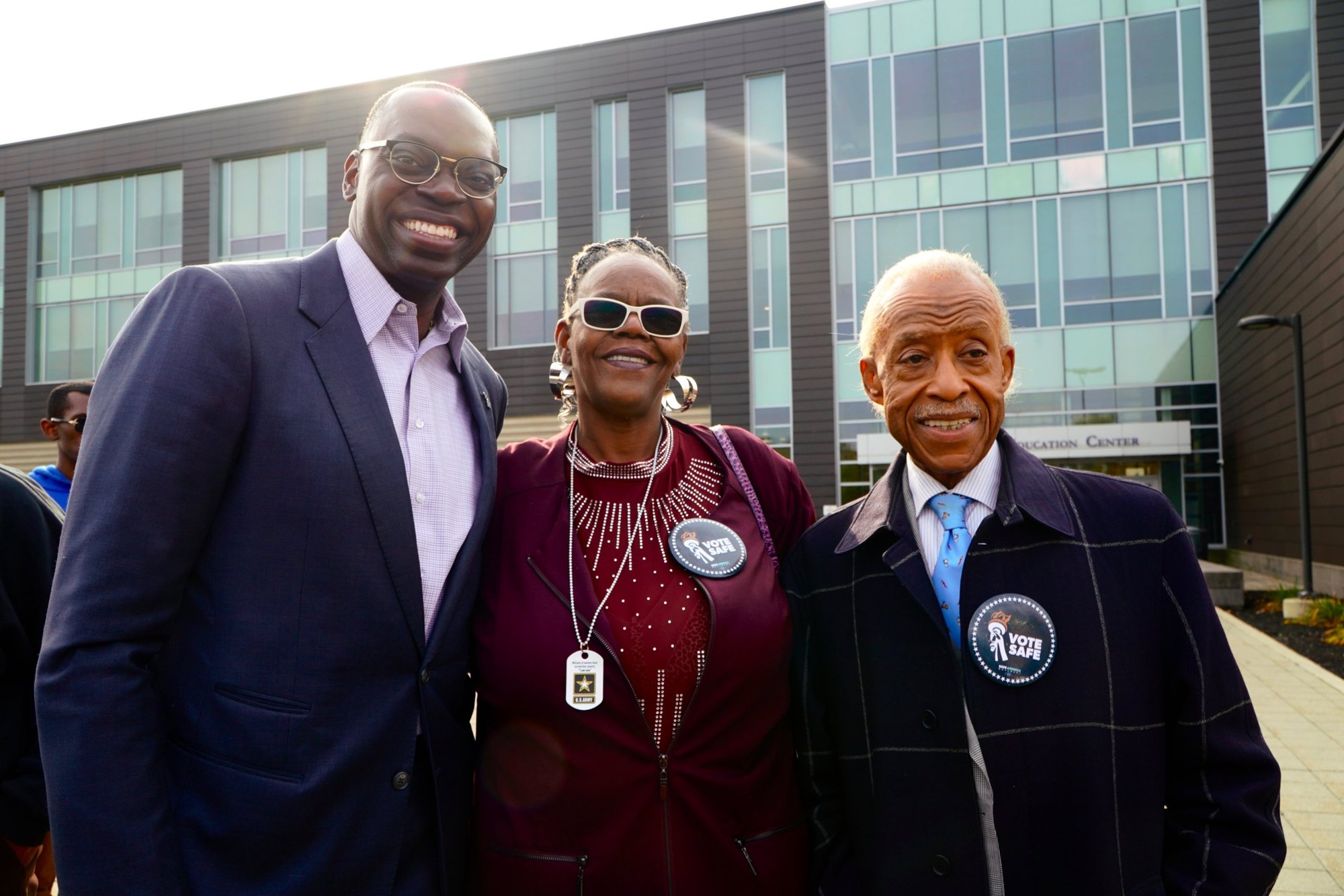 Lt. Governor Garlin Gilchrist II and Rev. Al Sharpton with a Vote Safe supporter