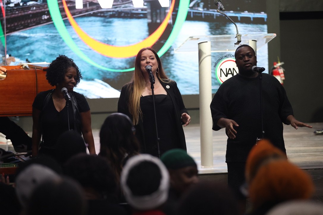 The praise team lifts the room in song