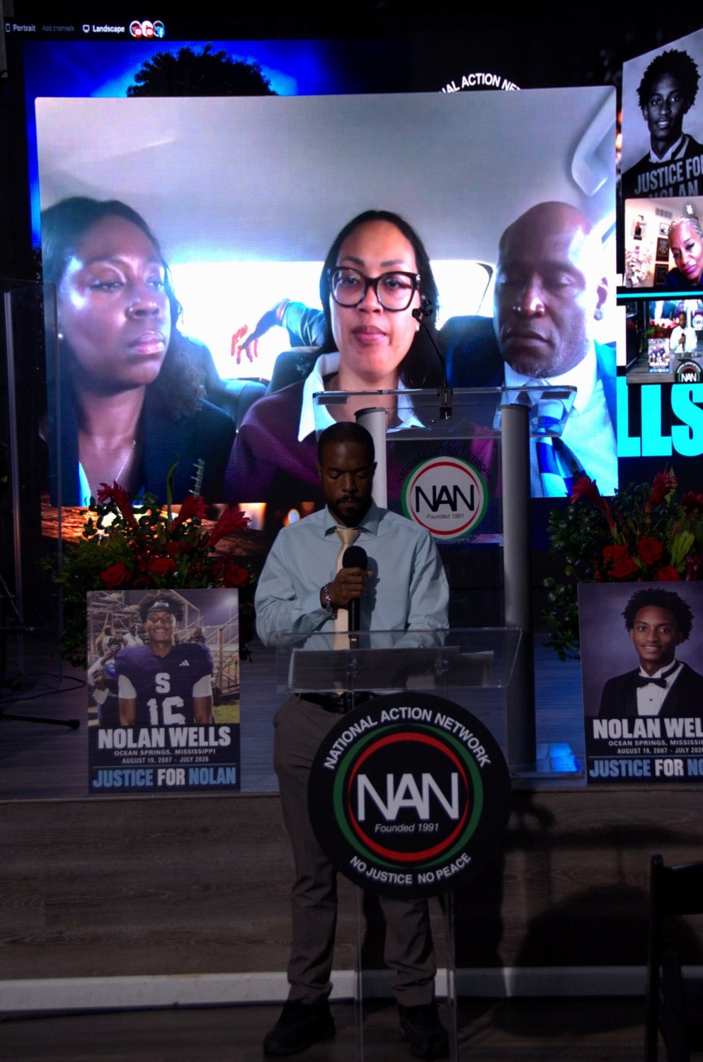 Nolan Wells's family joins the NAN Youth Huddle on the livestream as a speaker stands at the podium