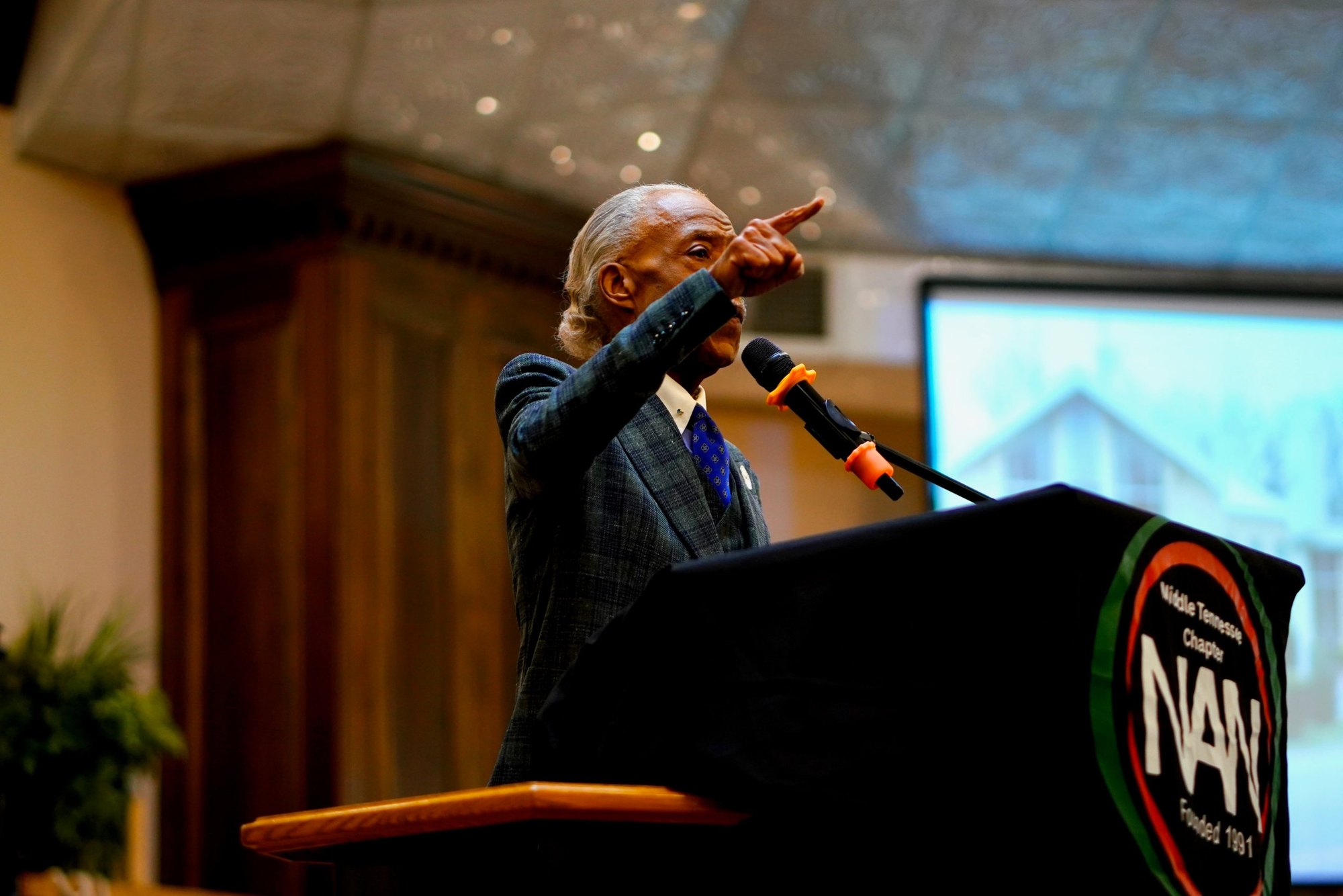 Rev. Al Sharpton points as he delivers remarks from the NAN Middle Tennessee Chapter podium